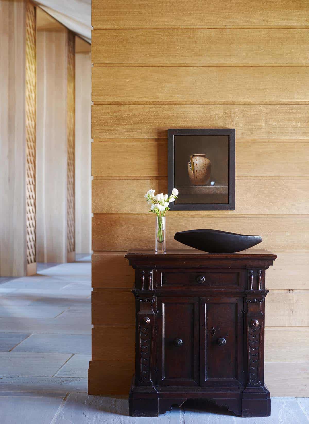 chalet-inspired lake house entry hall with a console table