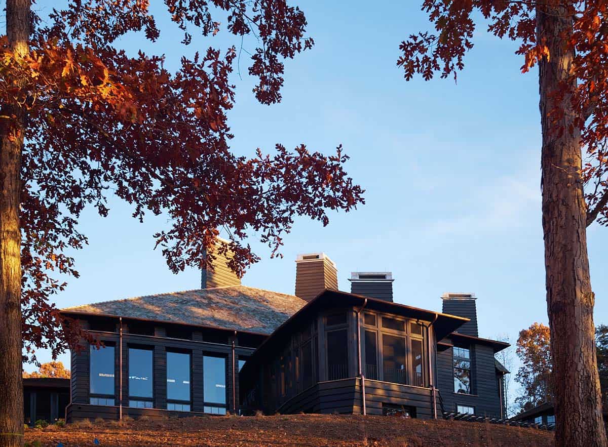 chalet-inspired lake house exterior backyard view