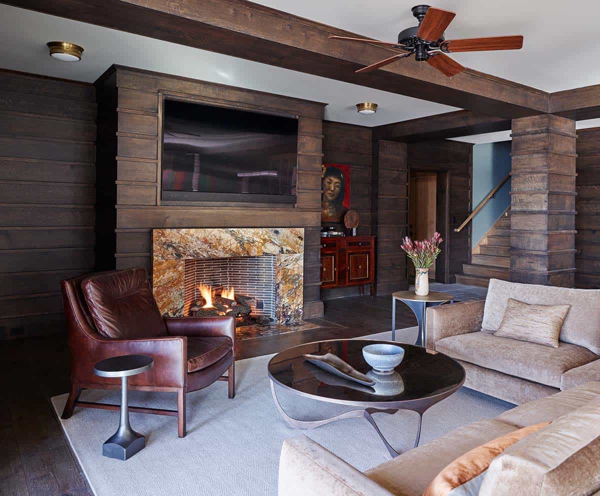 modern rustic family room with a fireplace