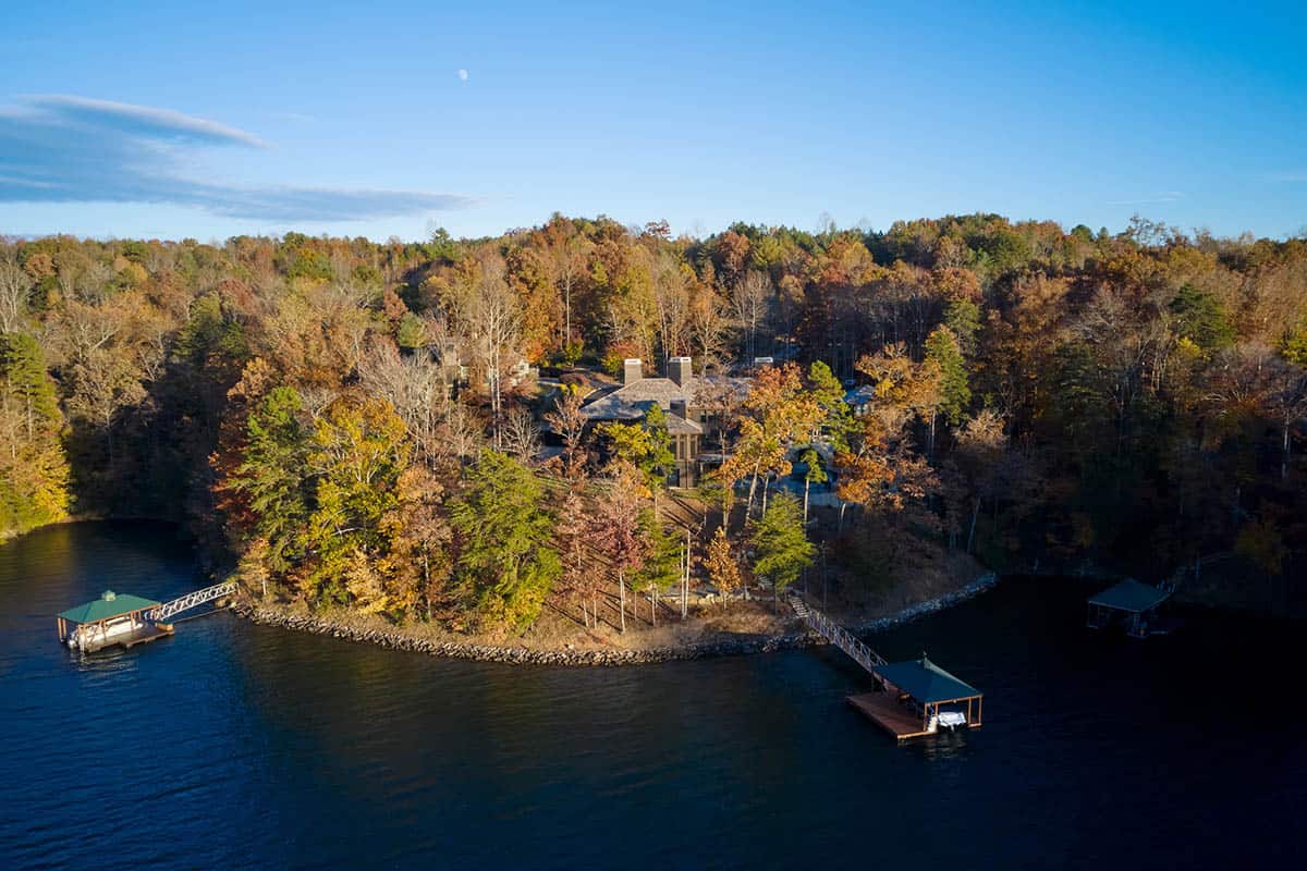 chalet-inspired lake house exterior aerial view