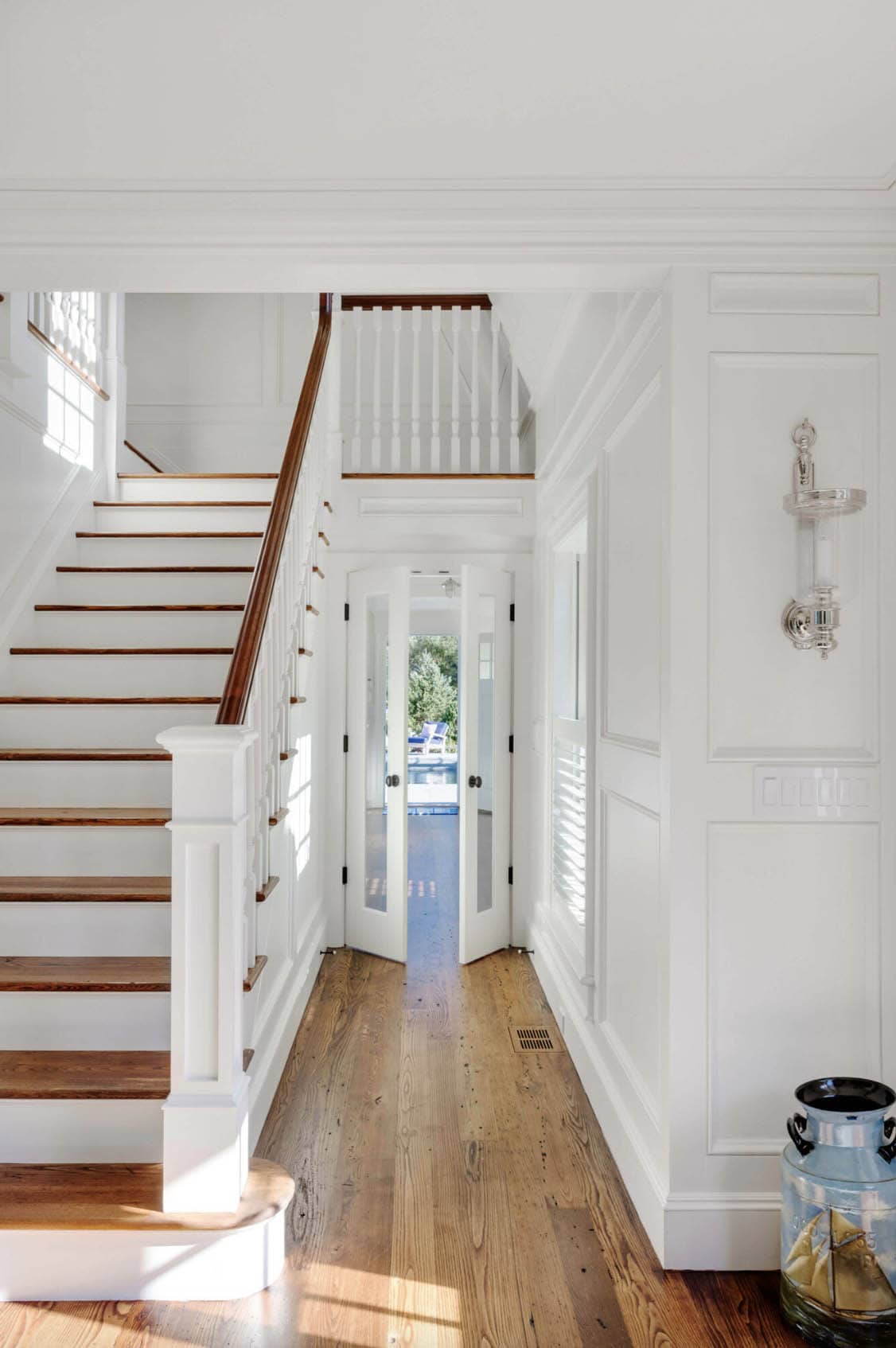 beach style home entry with a staircase