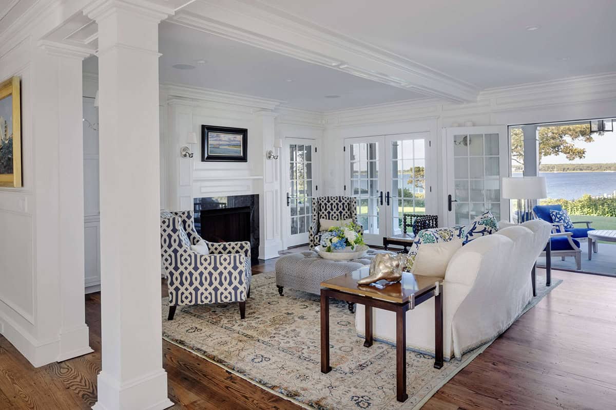 beach style living room with a fireplace