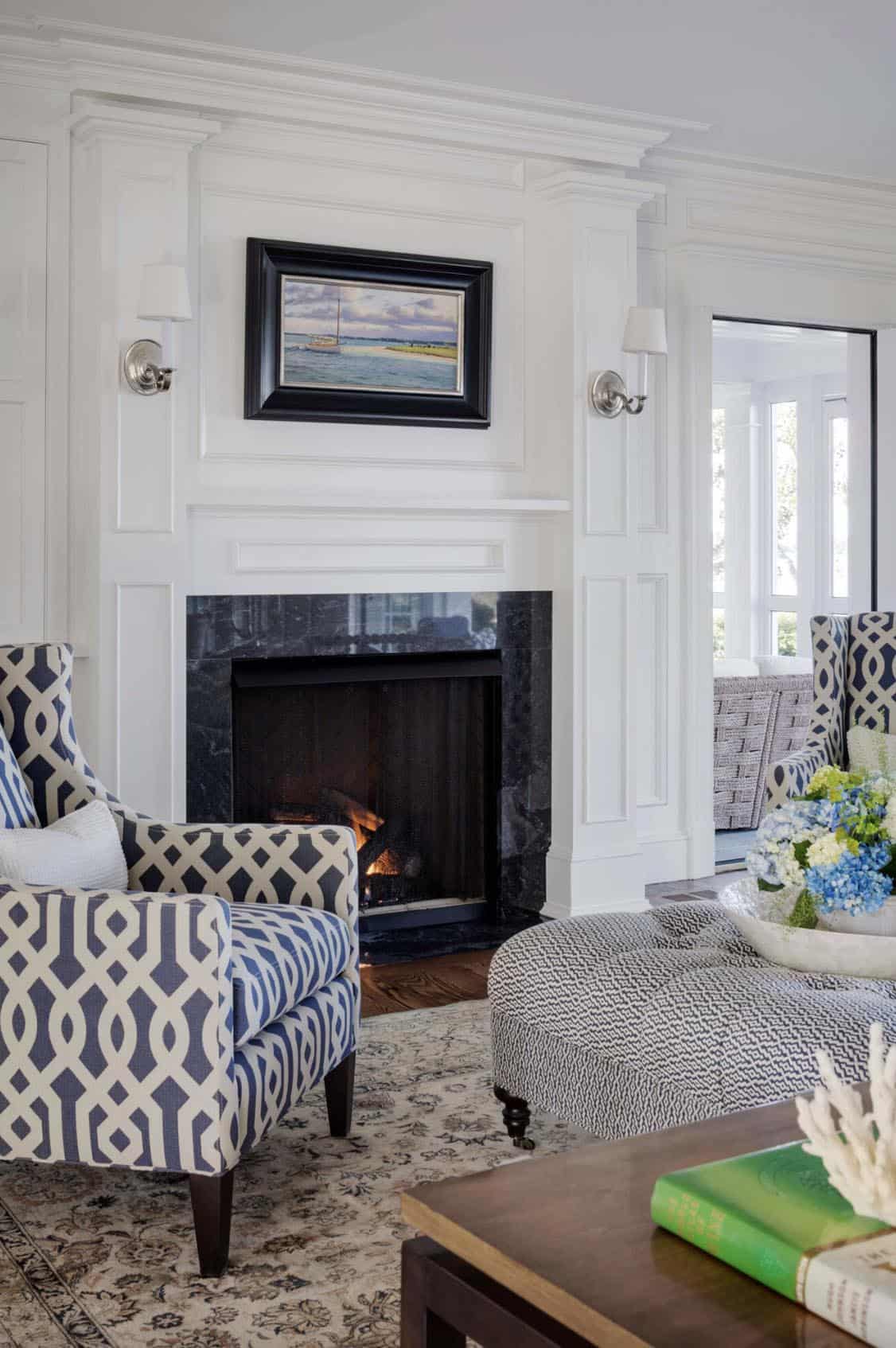 beach style living room with a fireplace