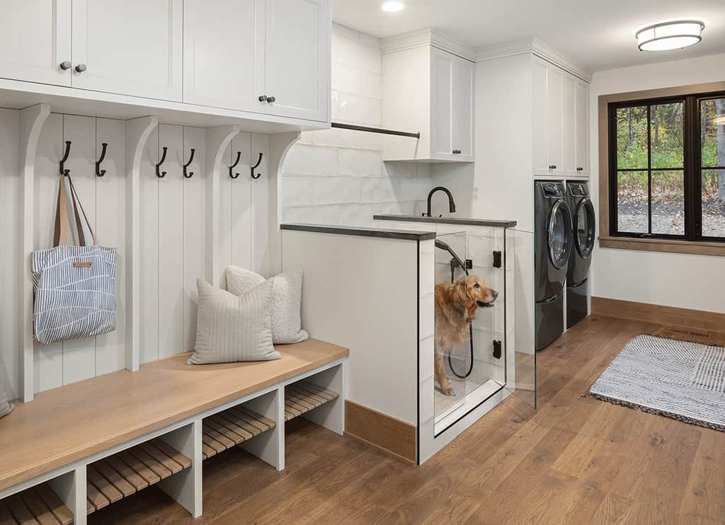 coastal style mudroom with a dog washing station