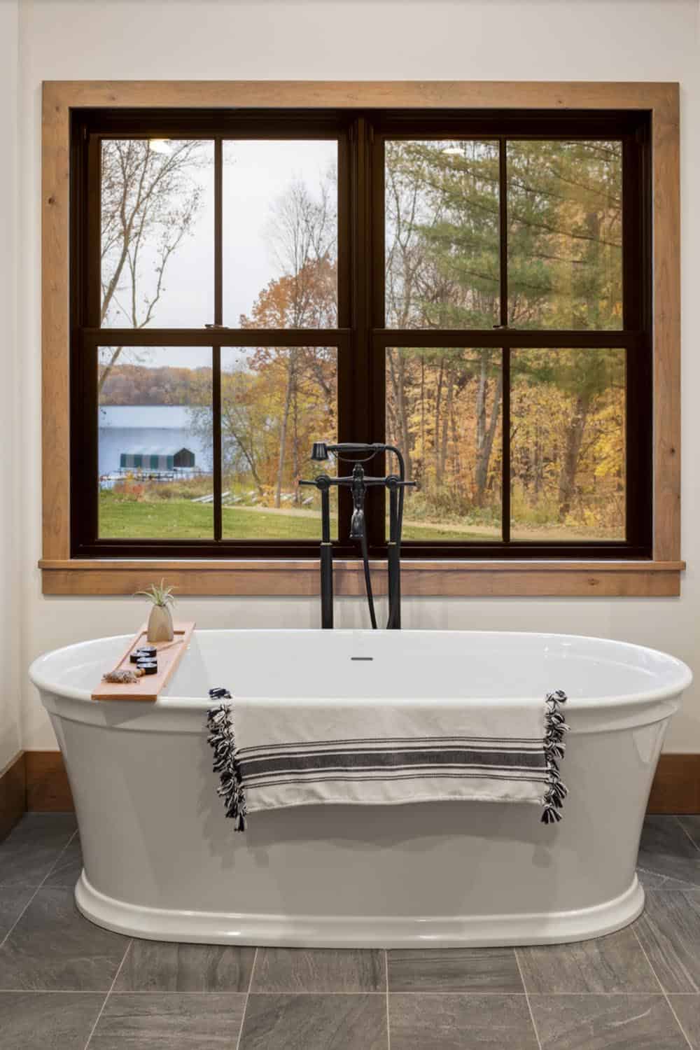 coastal style bathroom with a freestanding tub