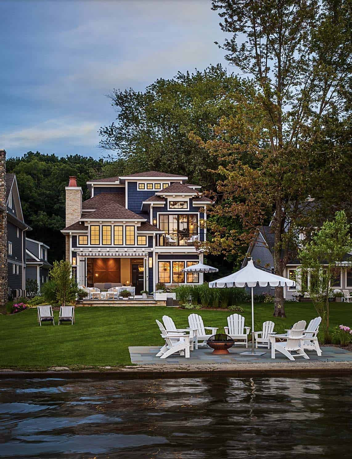 coastal style lake house backyard with a water view