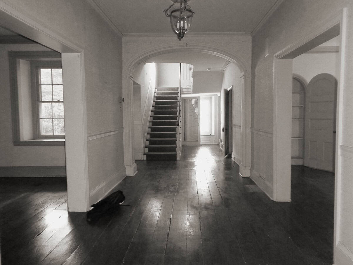 colonial-style farmhouse hallway before the remodel