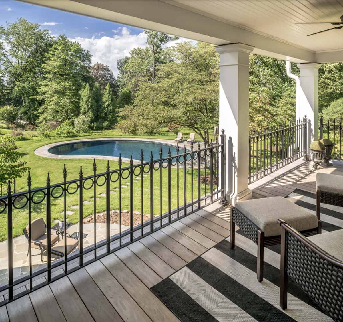 colonial-style farmhouse covered patio