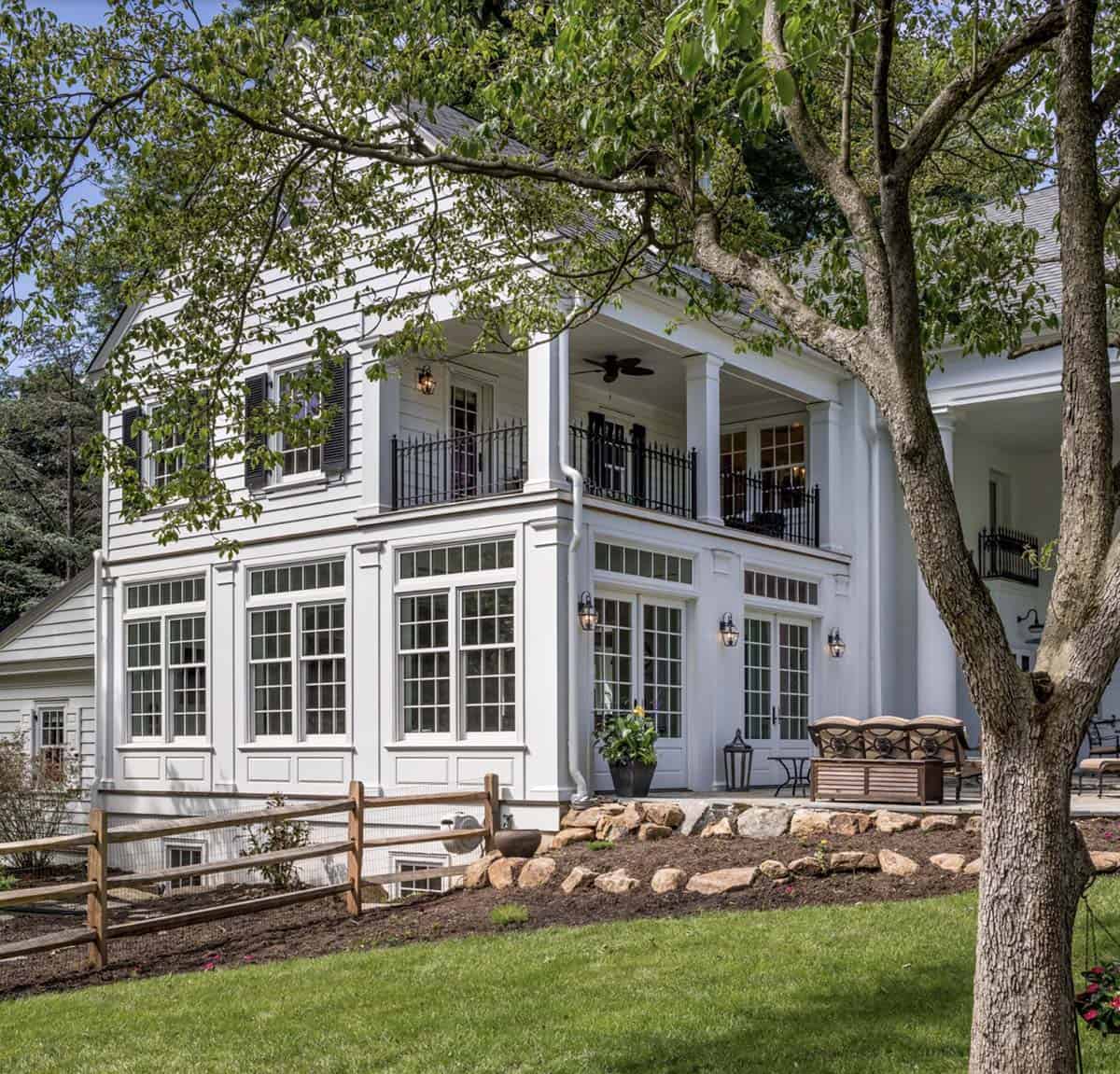 colonial-style farmhouse exterior backyard view