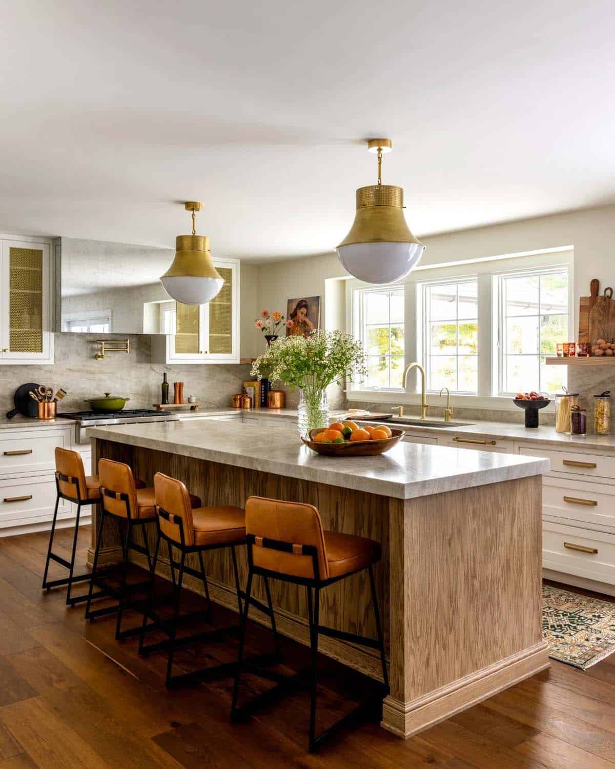 farmhouse style kitchen with large pendant lights