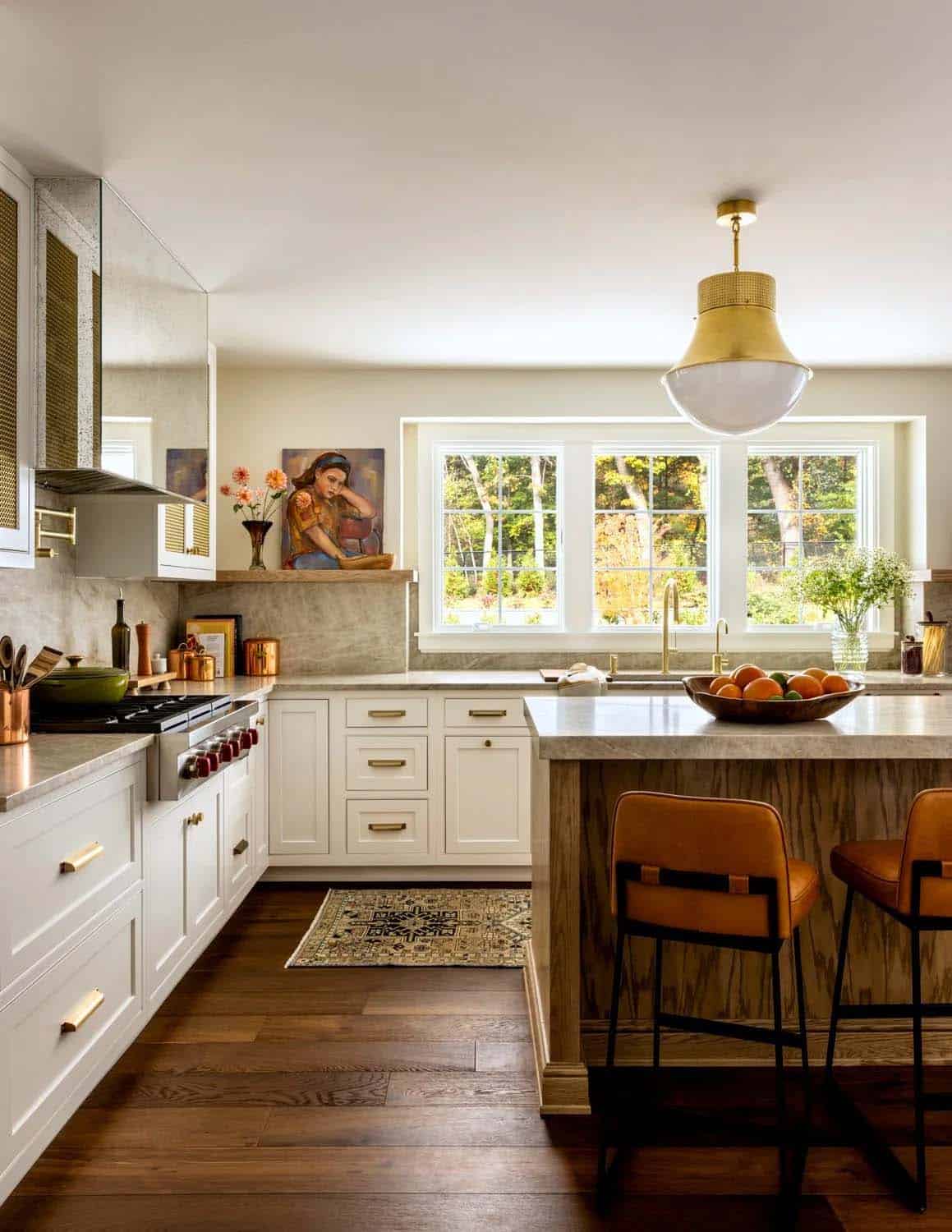 farmhouse style kitchen with large pendant lights