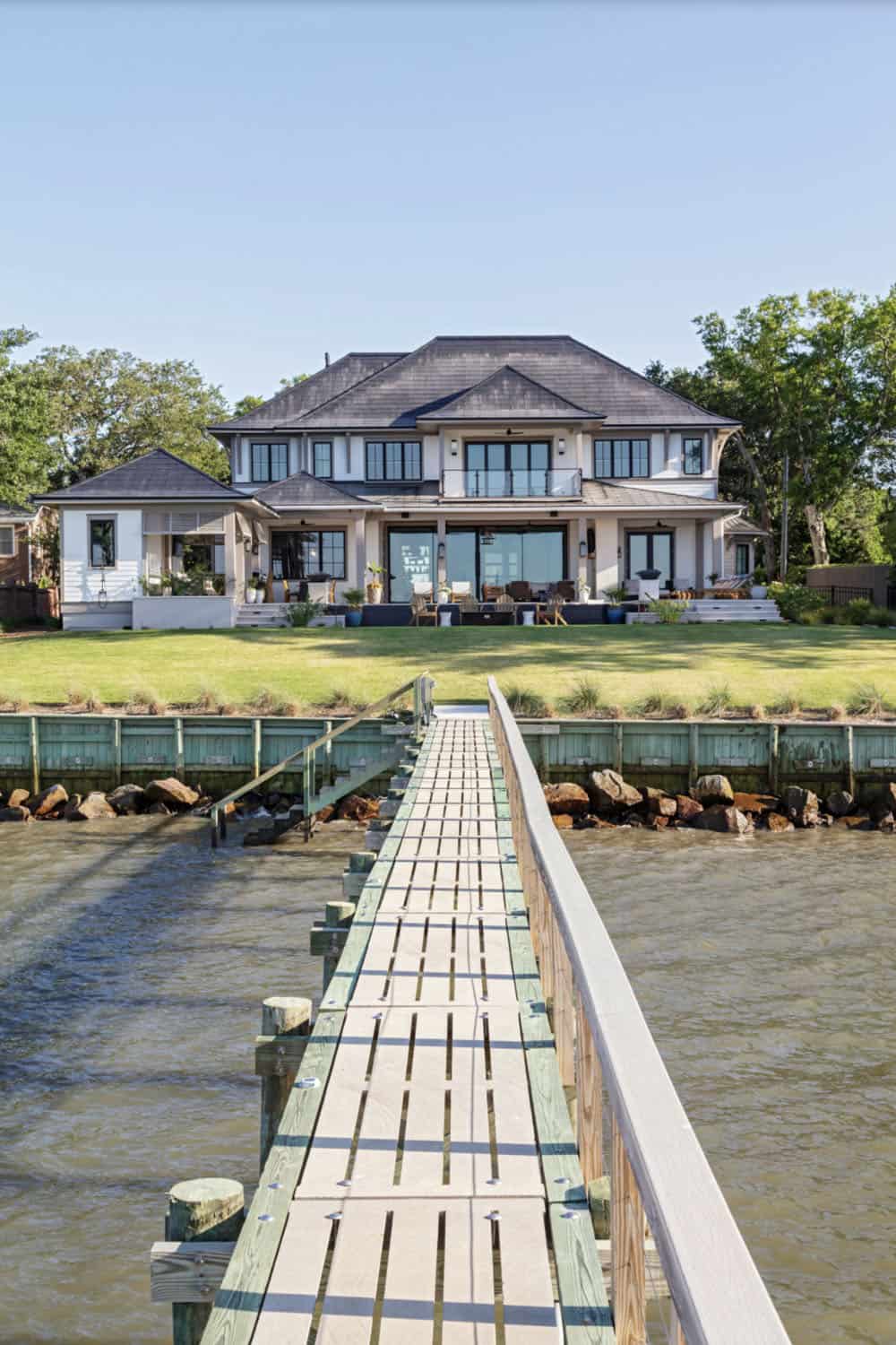 contemporary home exterior with a boat dock