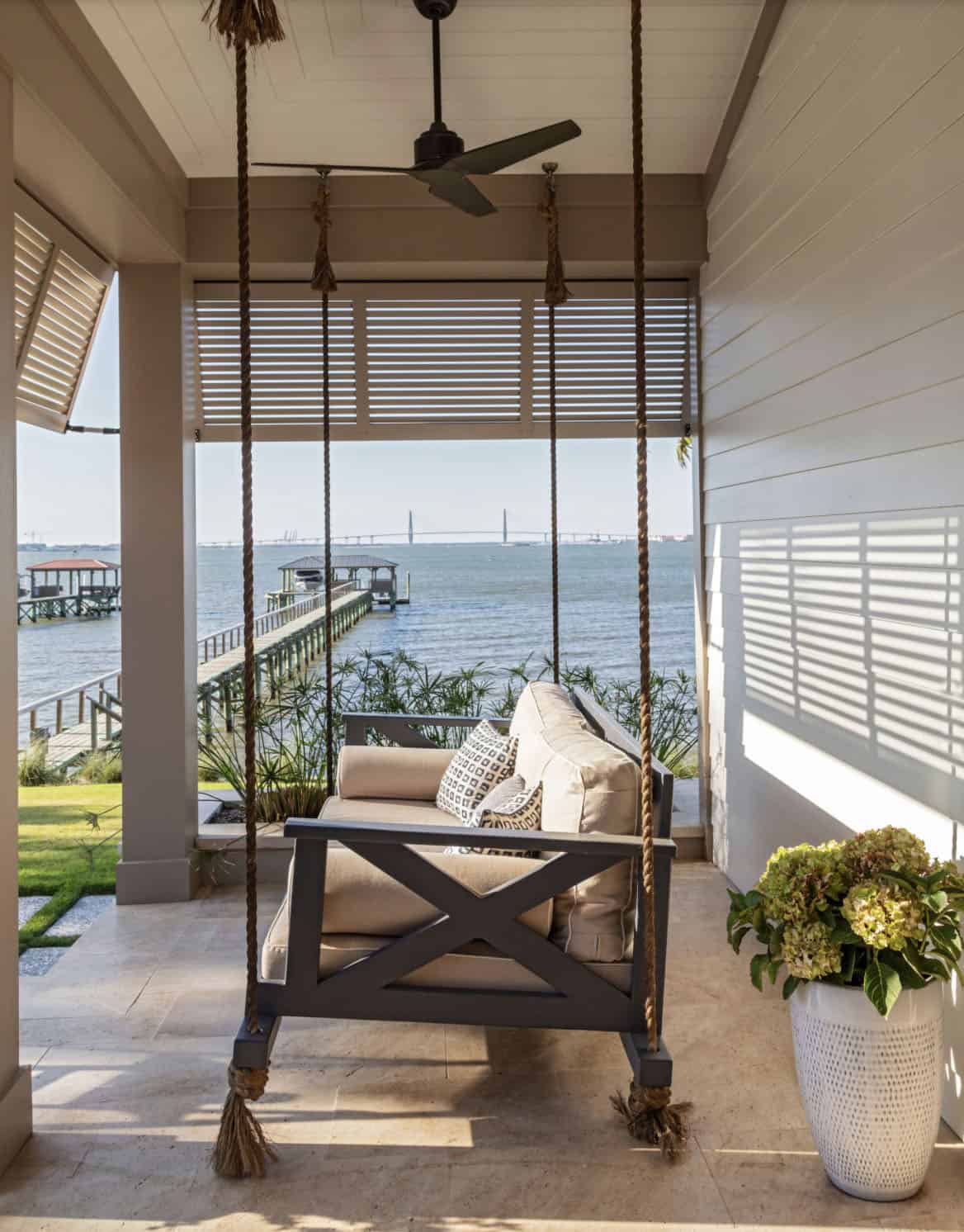 contemporary covered porch with a hanging daybed