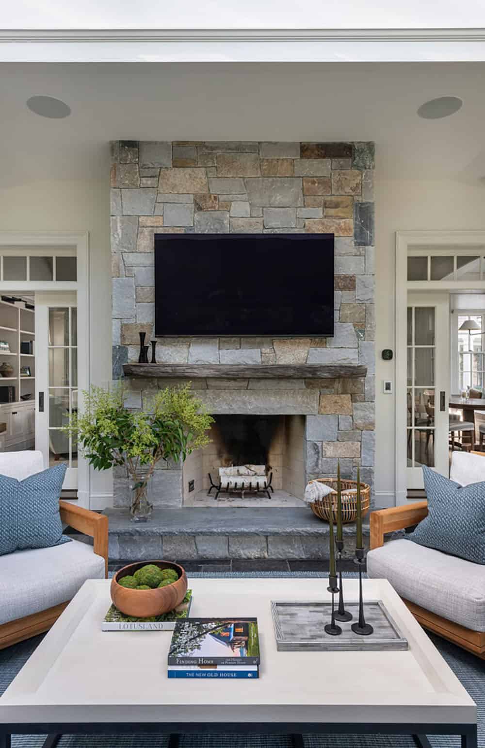 contemporary sunroom with a fireplace