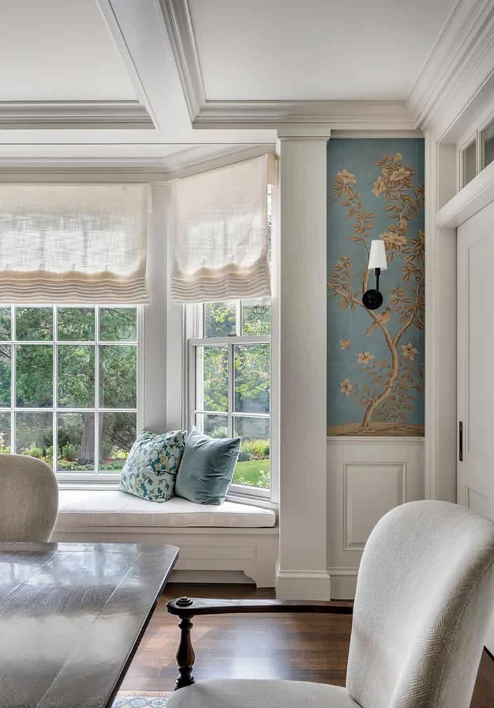 contemporary dining room with a built-in window seat