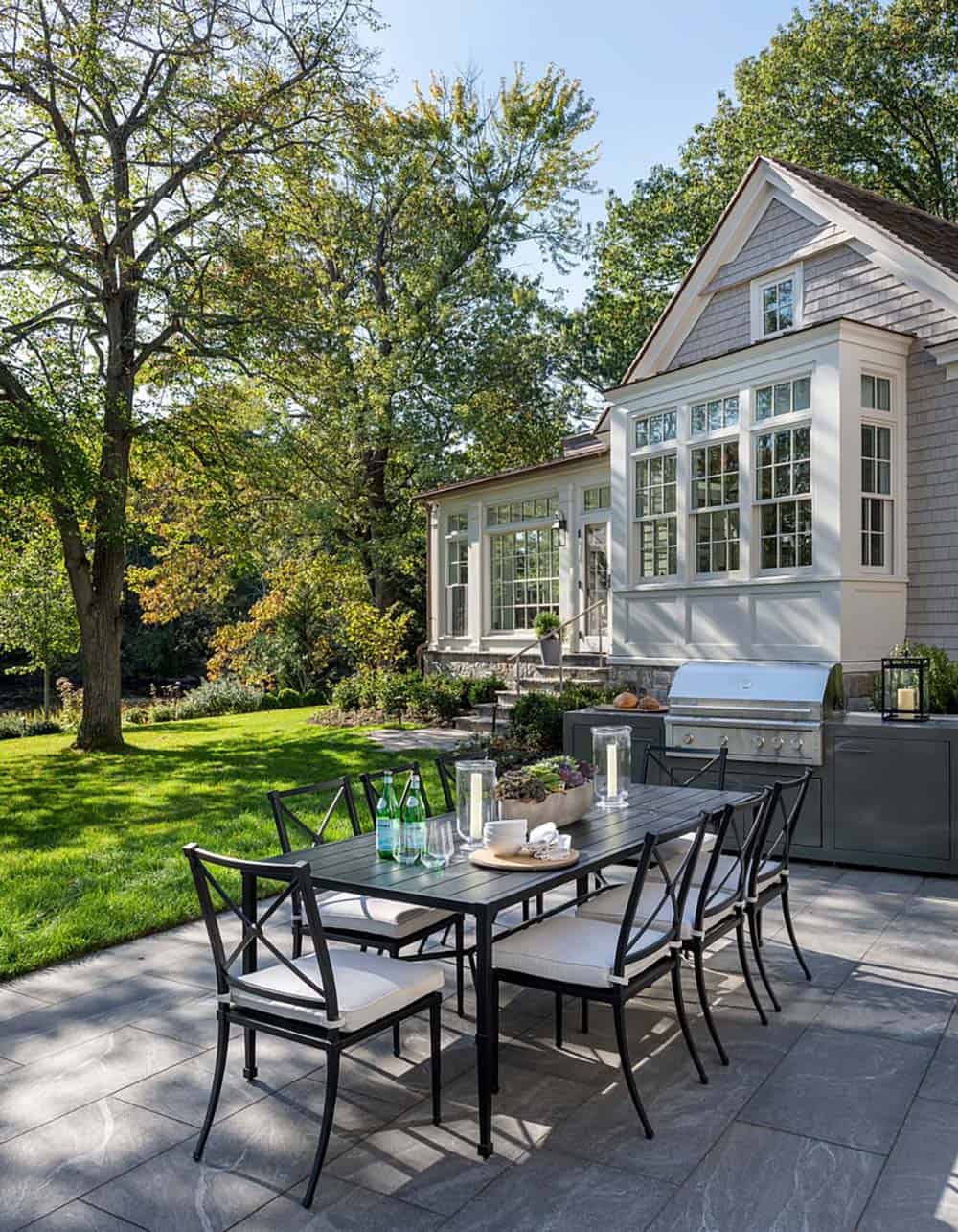 contemporary lake house backyard with alfresco dining