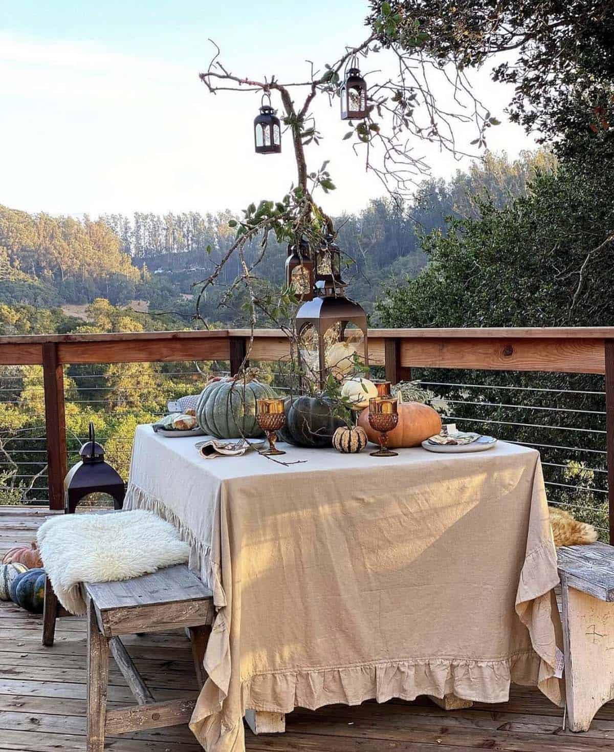 outdoor fall decorated dining table with lanterns