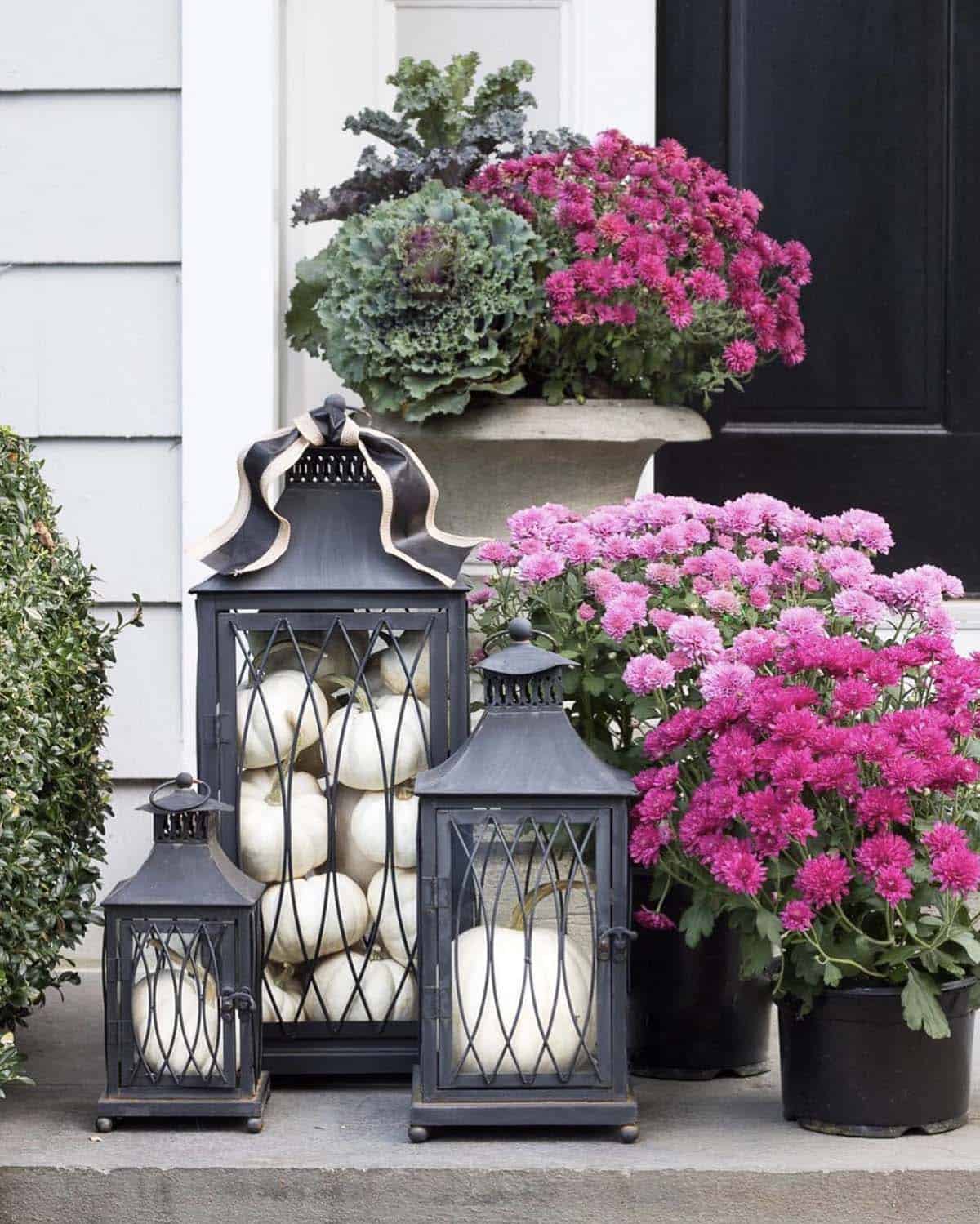 white pumpkin filled lanterns with mums