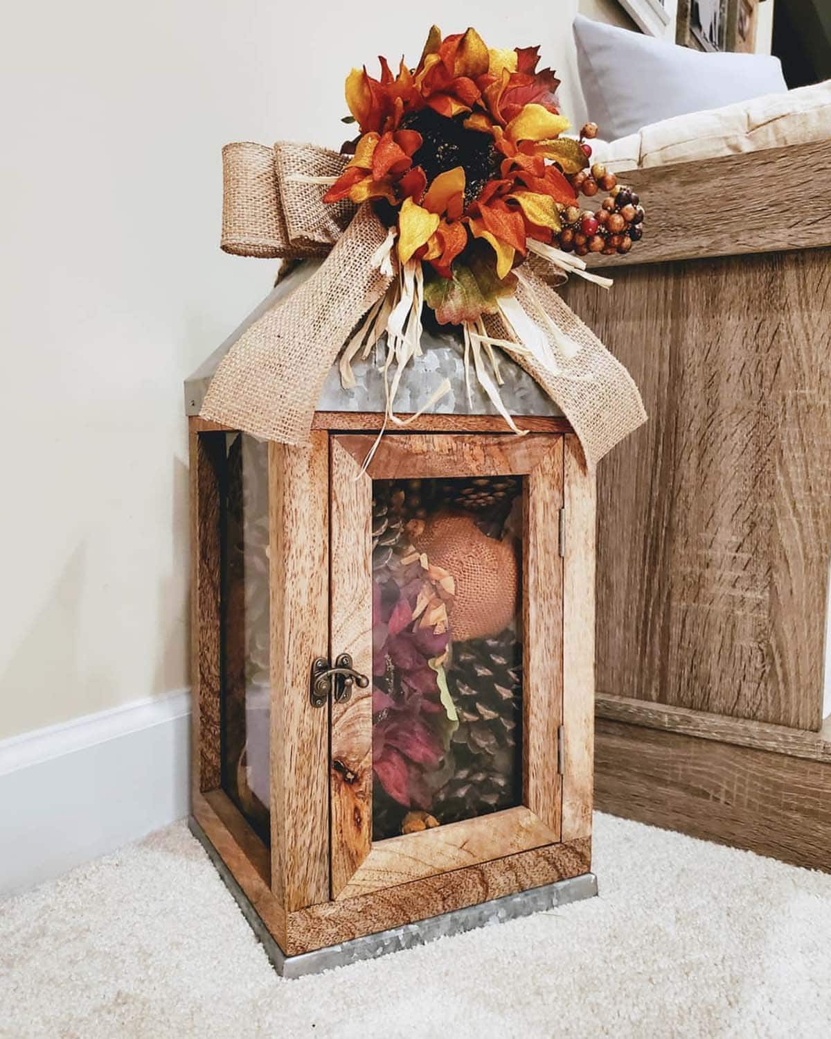 lantern with dried florals and pinecones