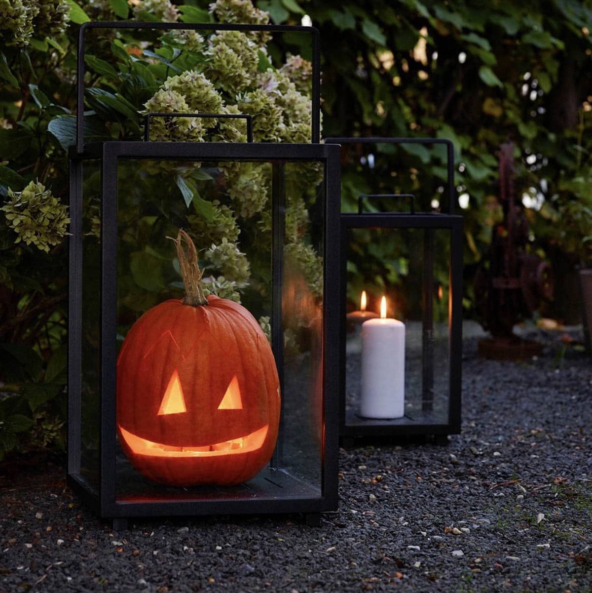 outdoor fall lanterns with a pumpkin and a candle