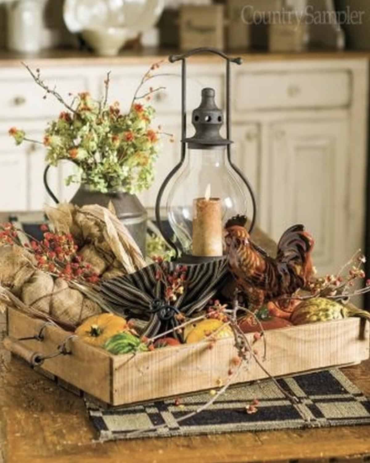 rustic autumn centerpiece with a lantern on the dining table