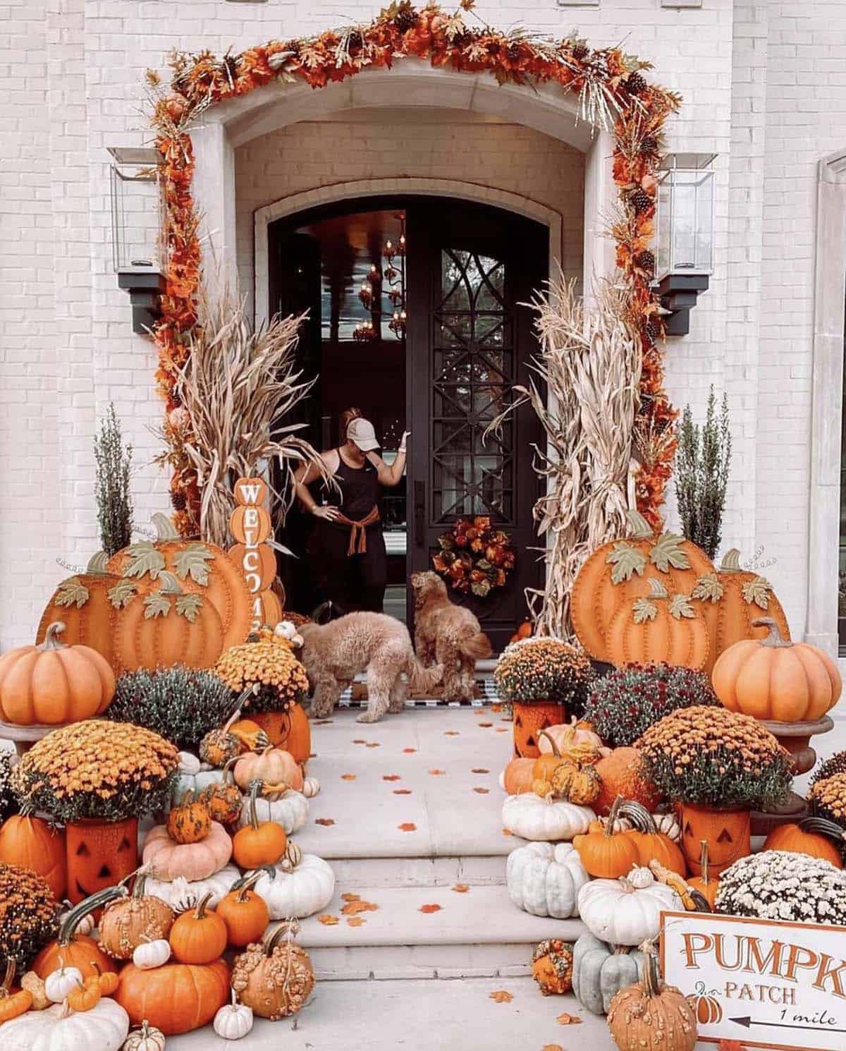fall front porch with a variety of pumpkins