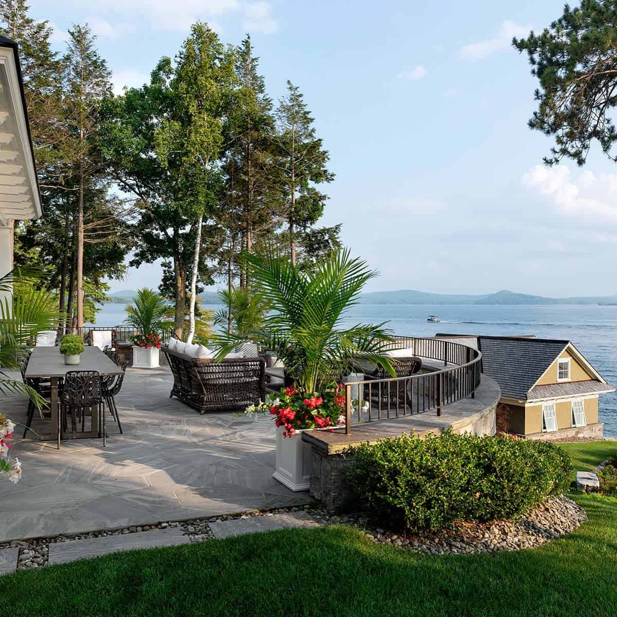lake house exterior with a patio and outdoor furniture