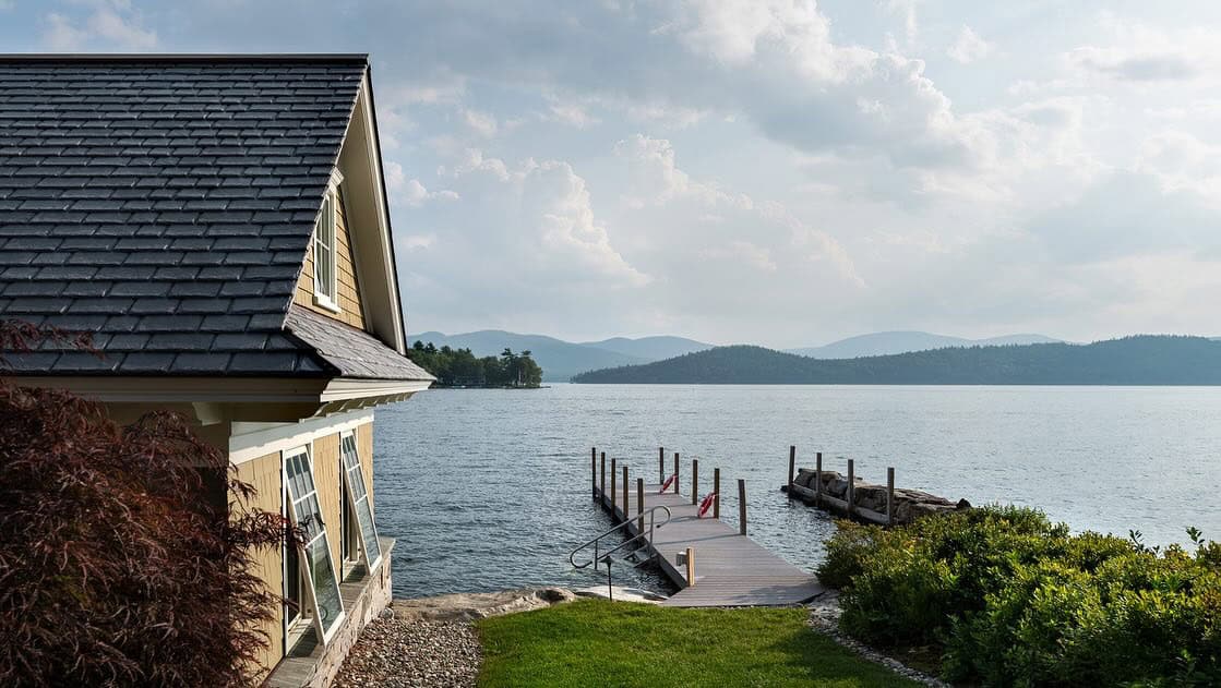 lake house exterior with a boat house and dock