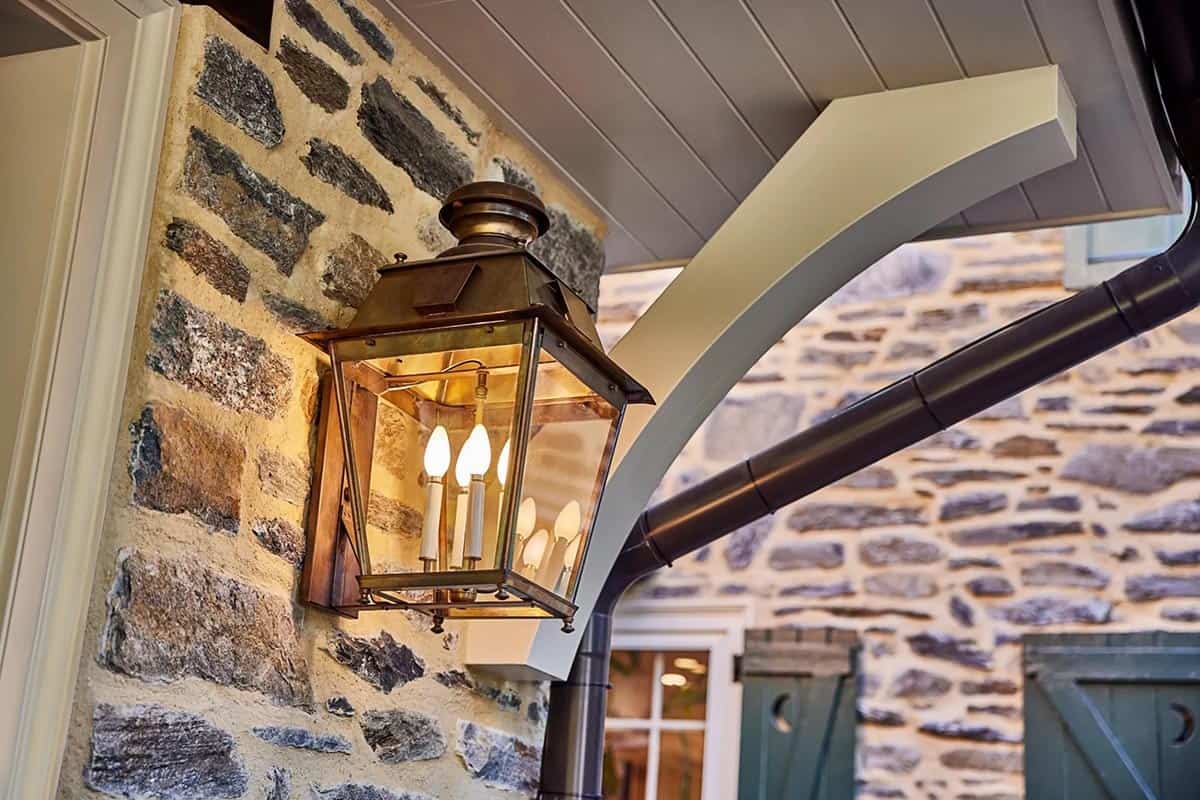 stone house exterior light fixture detail
