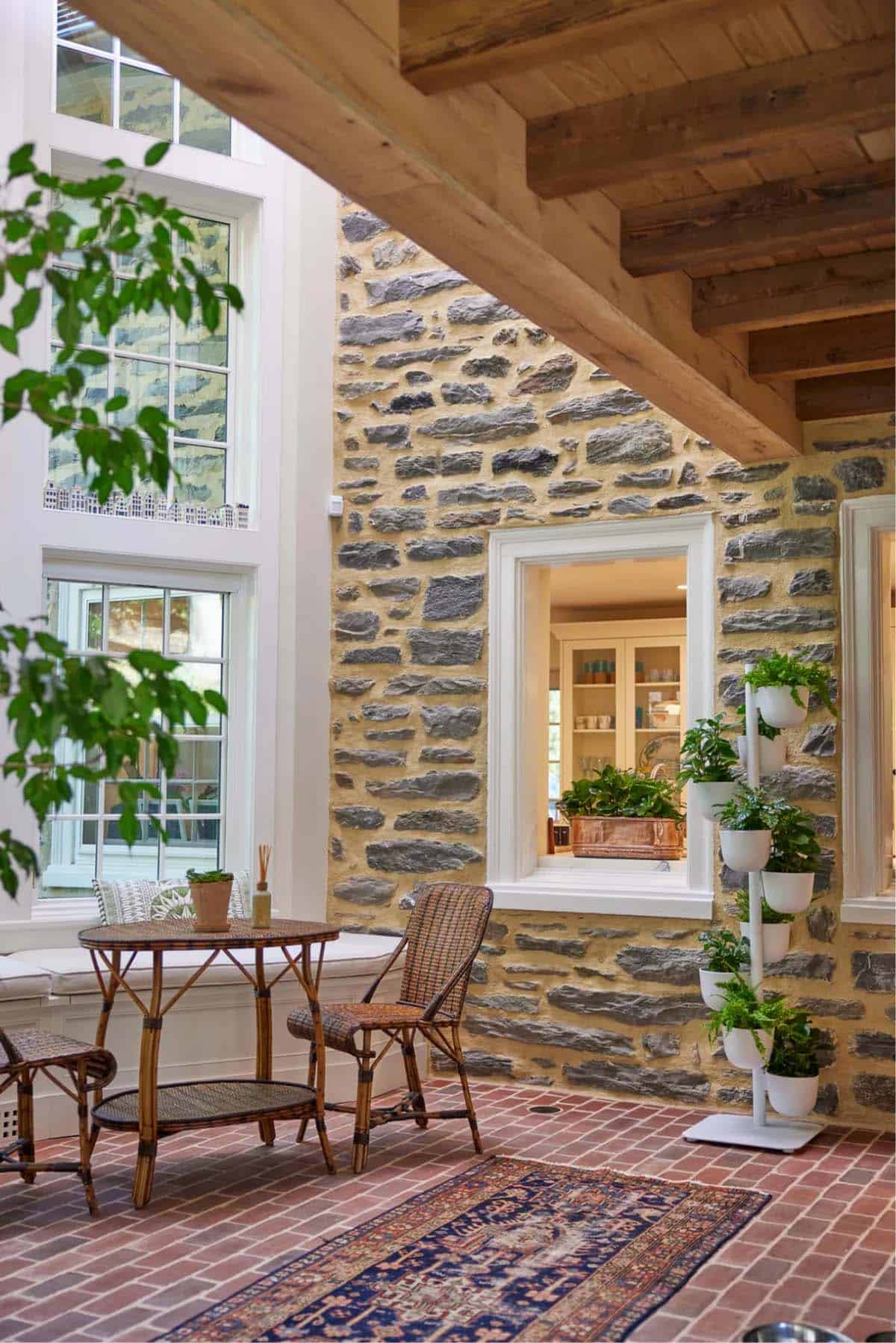 stone cottage with a glassy atrium