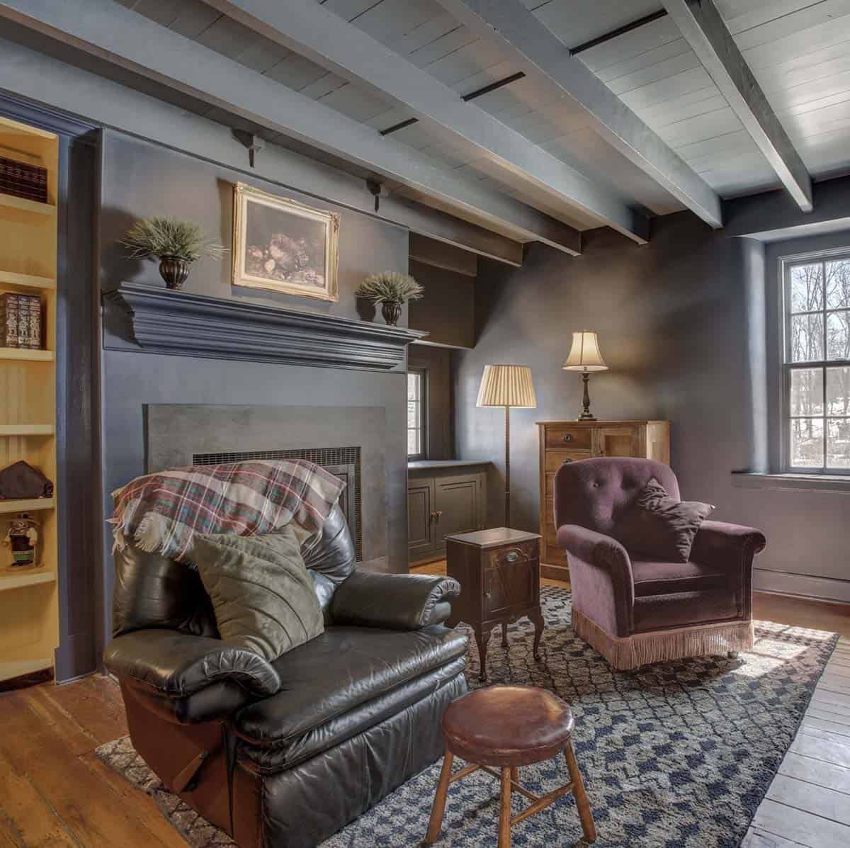 farmhouse style family room with a fireplace