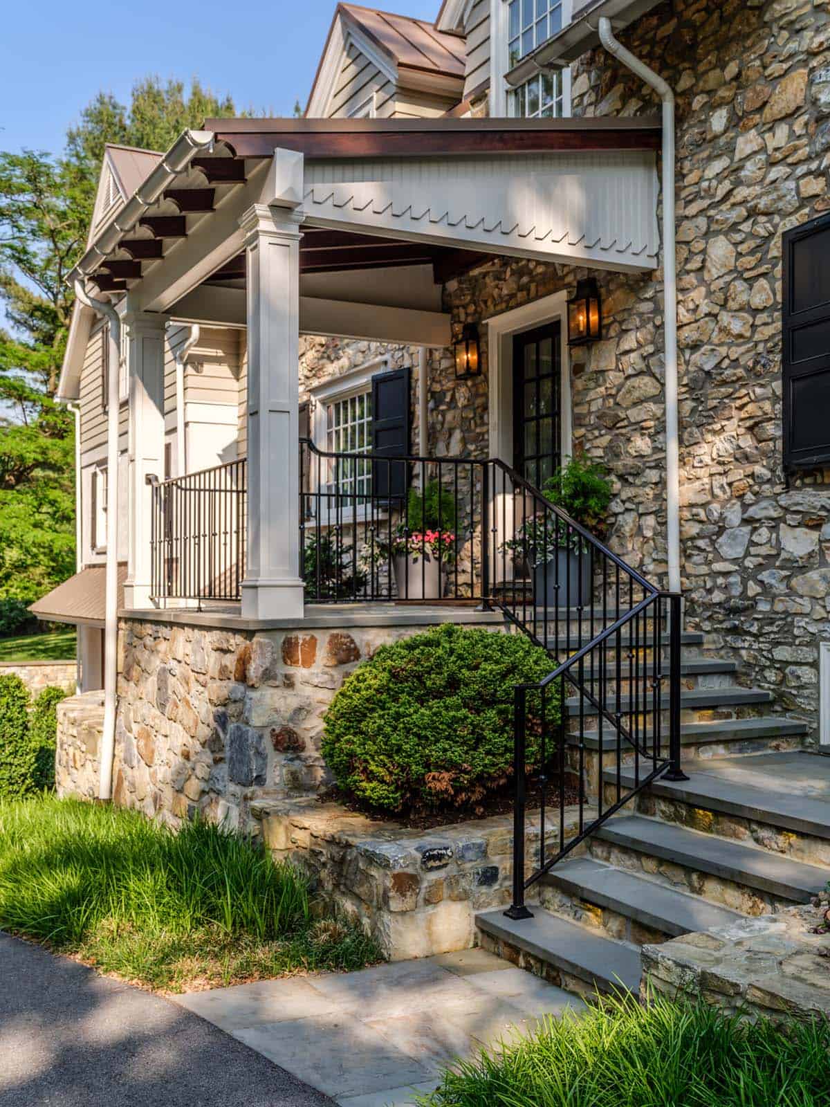 stone house exterior wotj steps leading up to the front porch