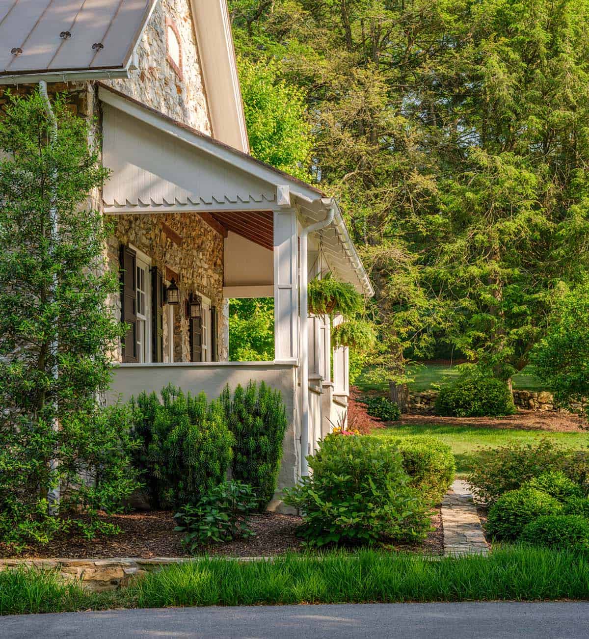 stone house exterior with landscaping