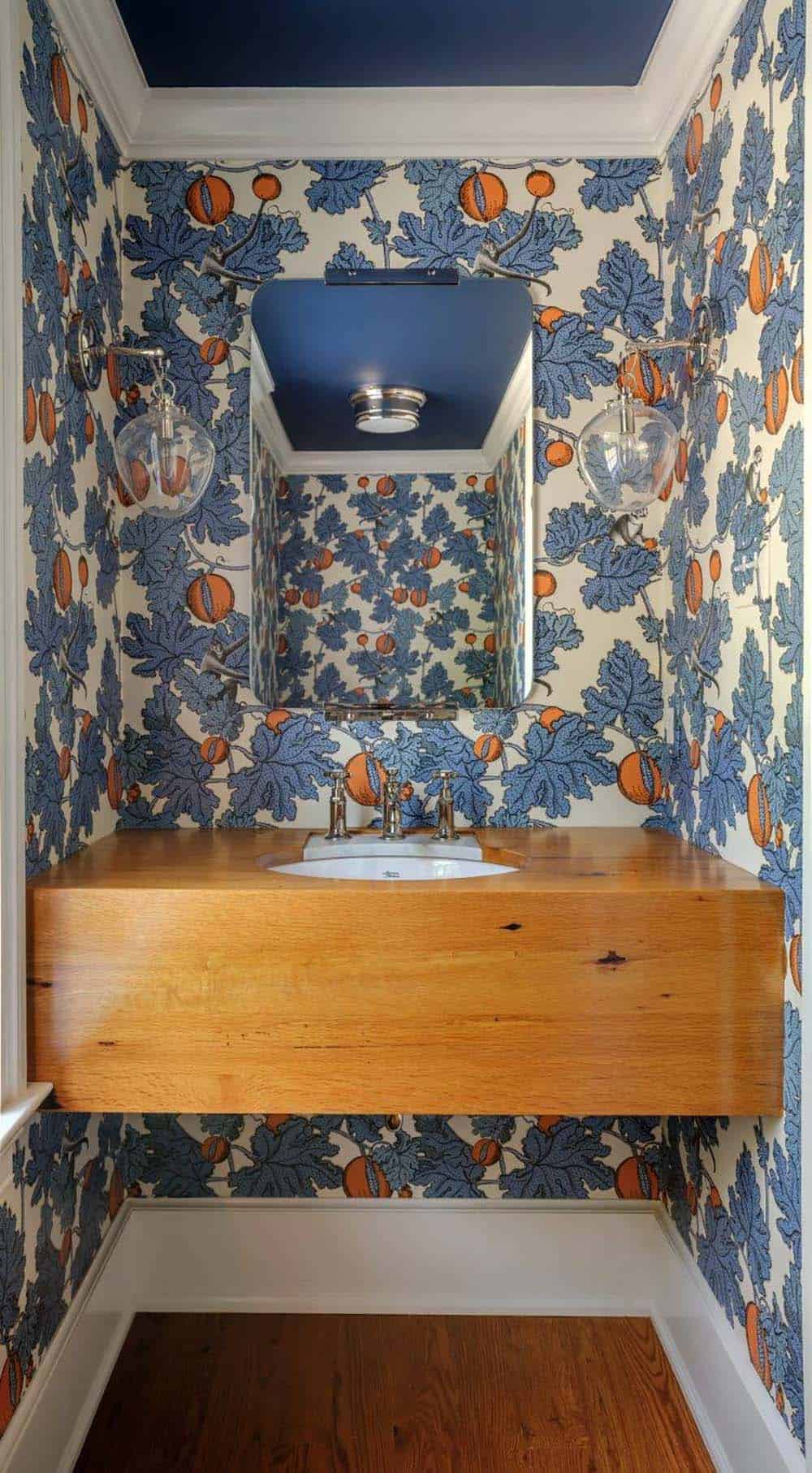 traditonal style powder room with wallpaper