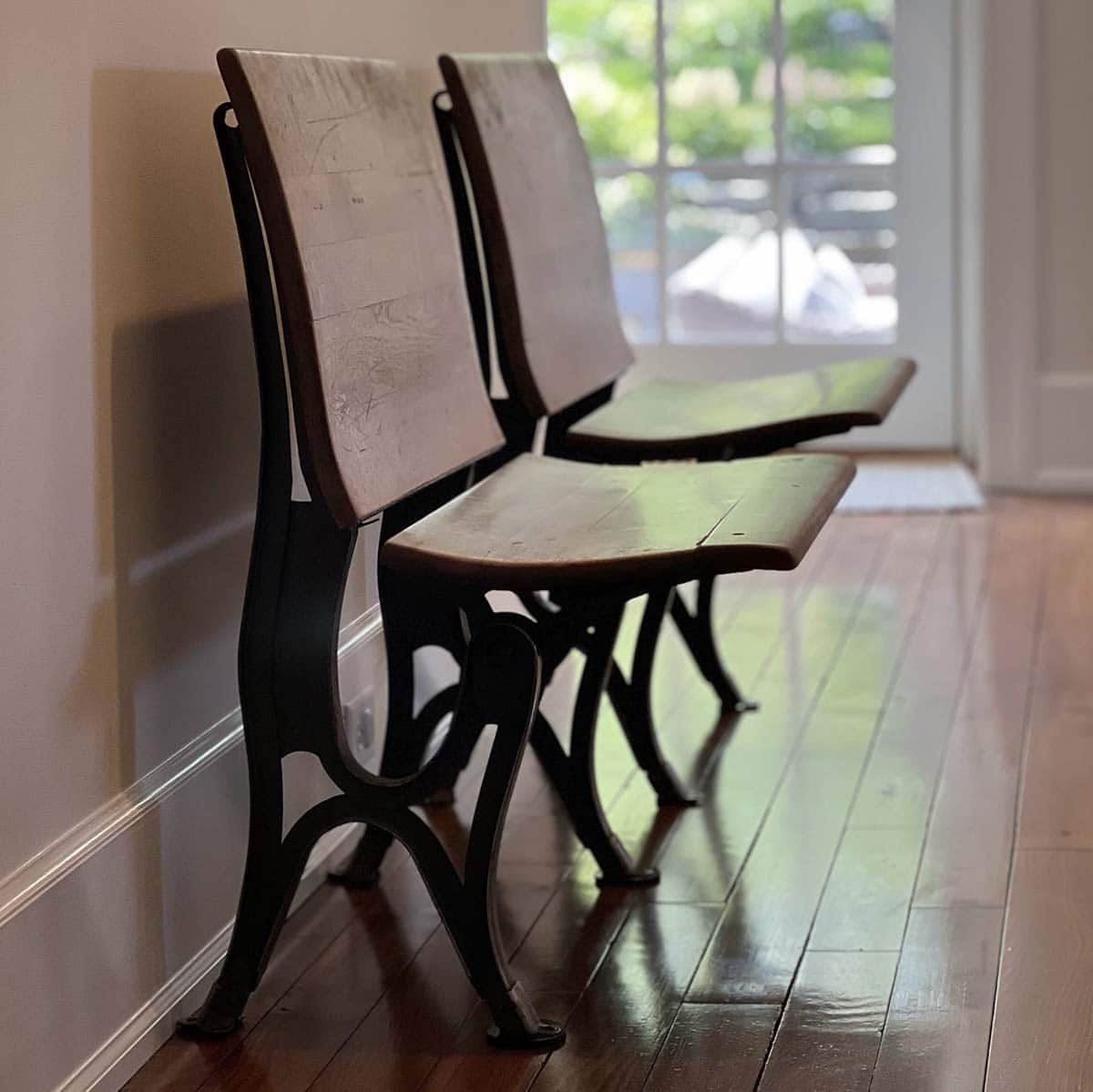 stone house entry with original schoolhouse chairs