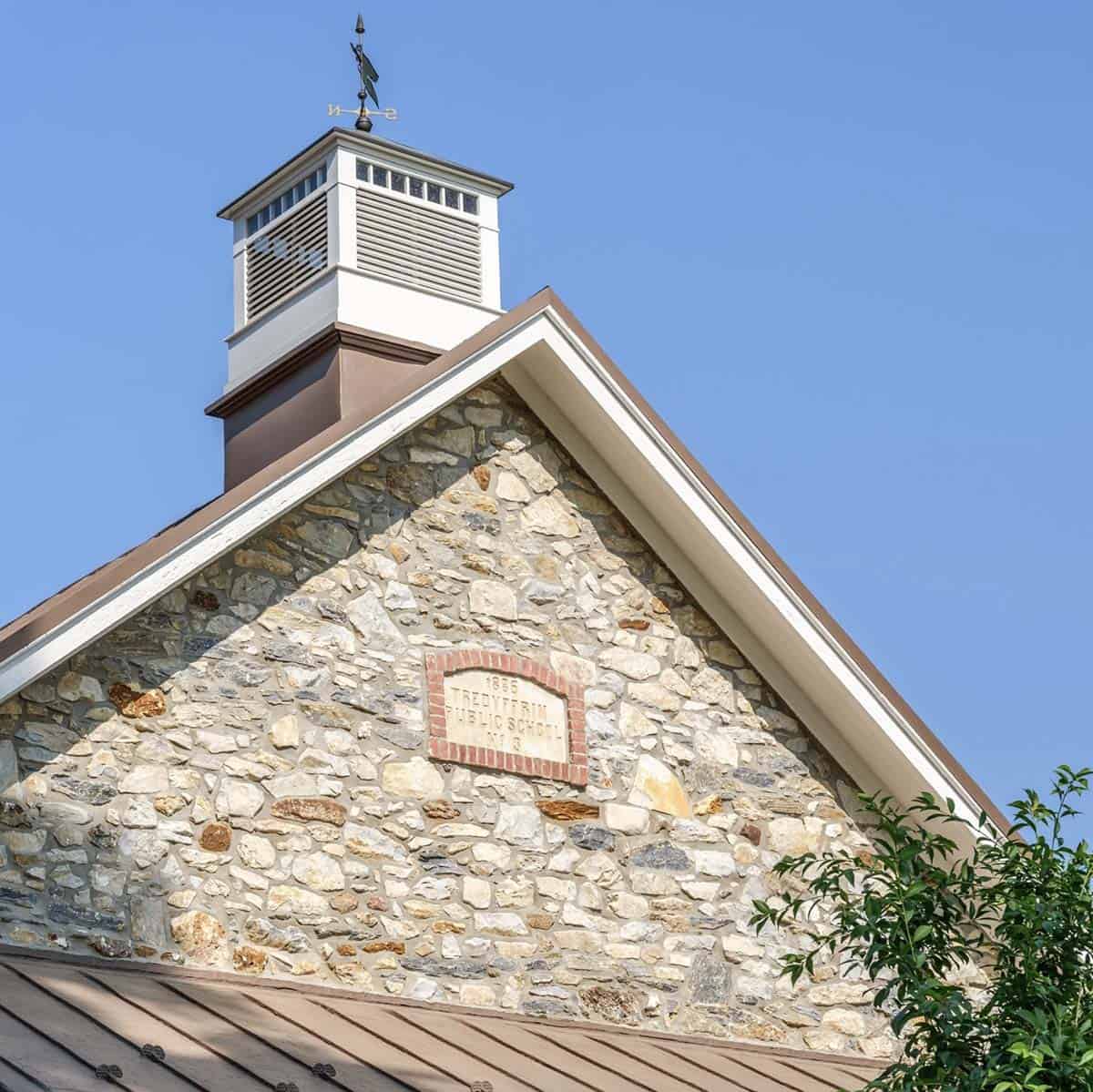 stone house exterior roof detail with a cupola 
