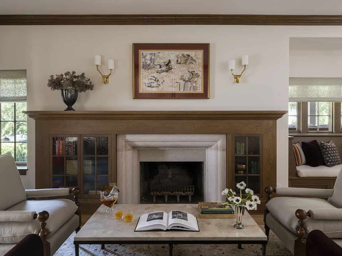 contemporary home library with a fireplace