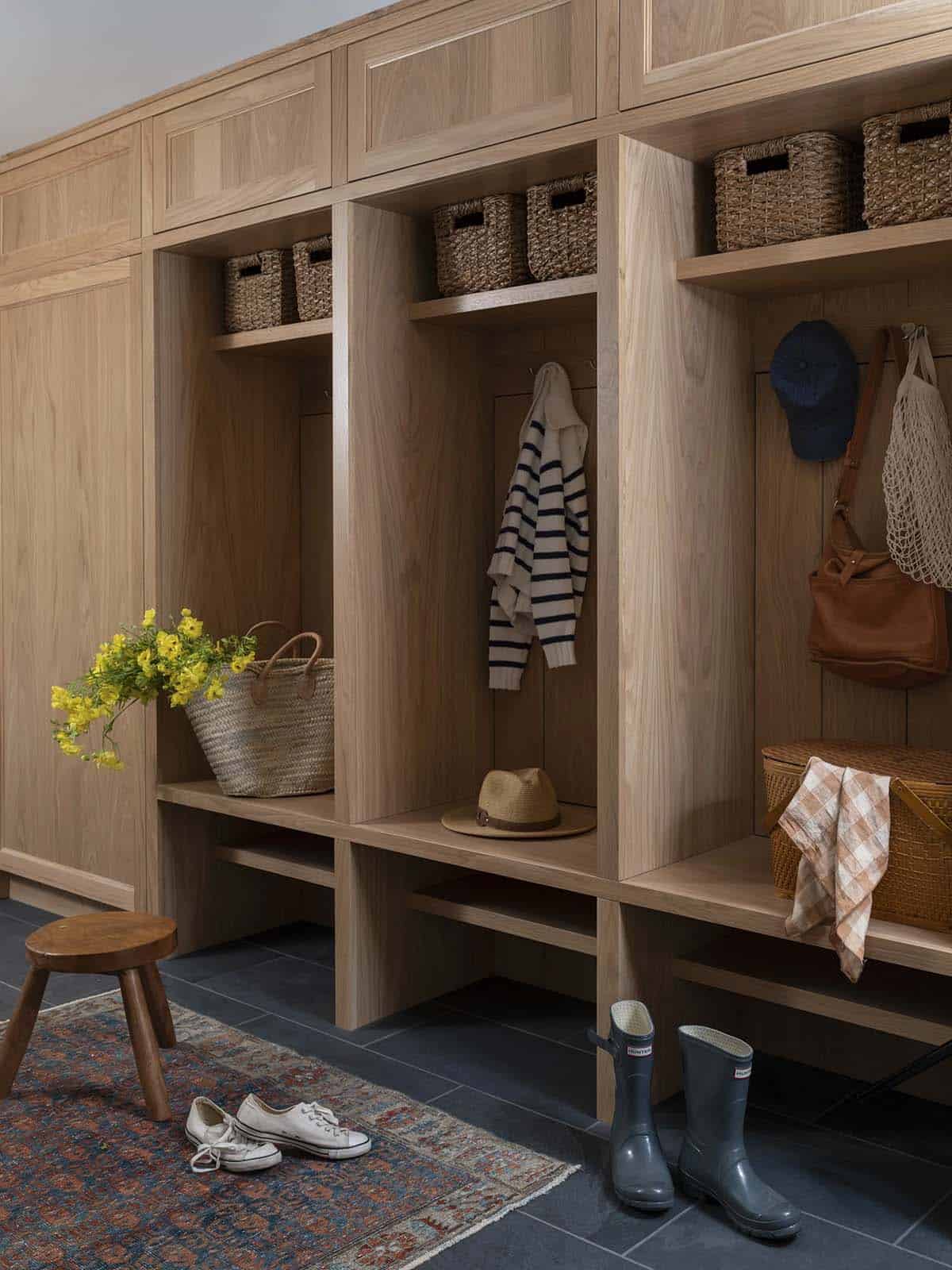contemporary mudroom with built-in storage cubbies