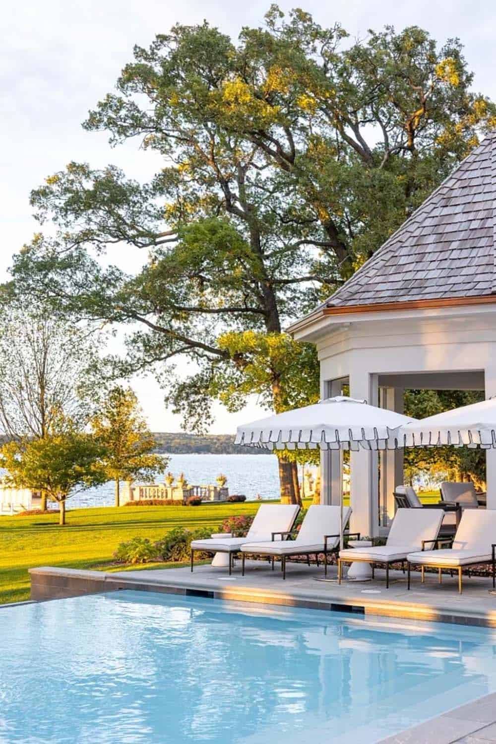 lake house exterior with a pool