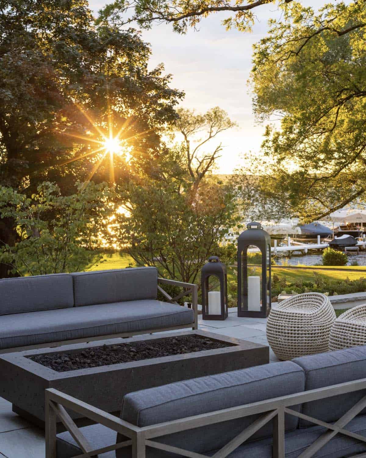 lake house exterior with outdoor furniture and a sunset view over the lake