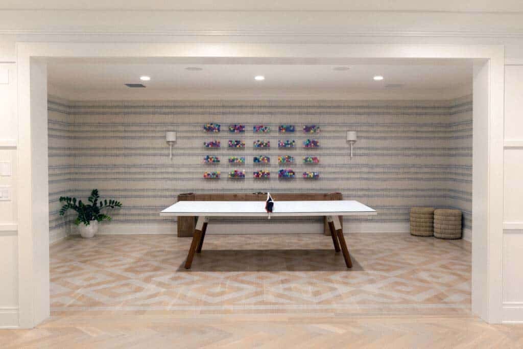 contemporary basement level entertainment area with a ping pong table 