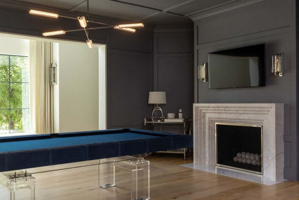 contemporary pool table with a fireplace