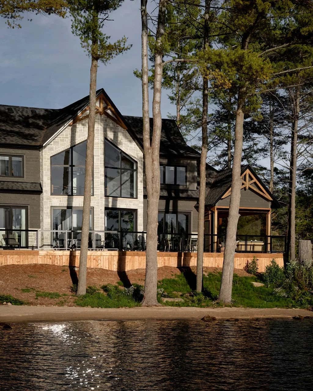 traditional style lake house exterior with a lake view