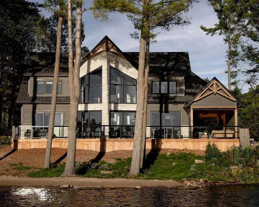 traditional style lake house exterior with a lake view