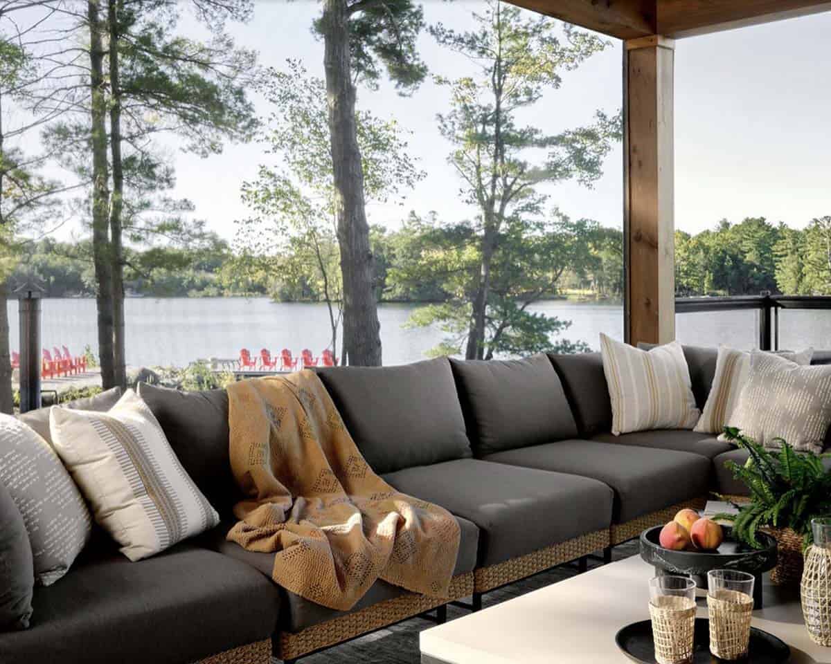 transitional style lake house balcony with outdoor furniture