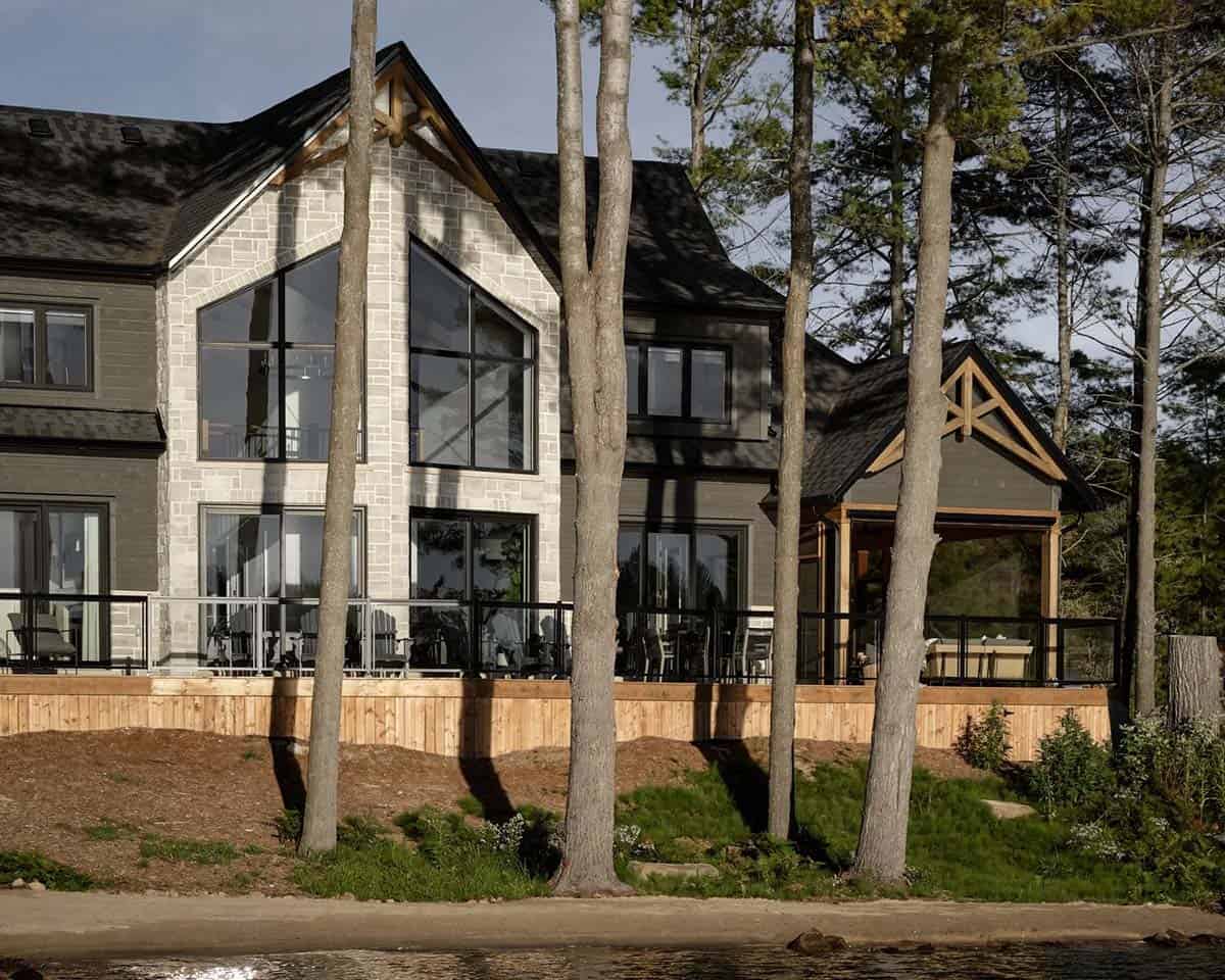 traditional style lake house exterior with a lake view