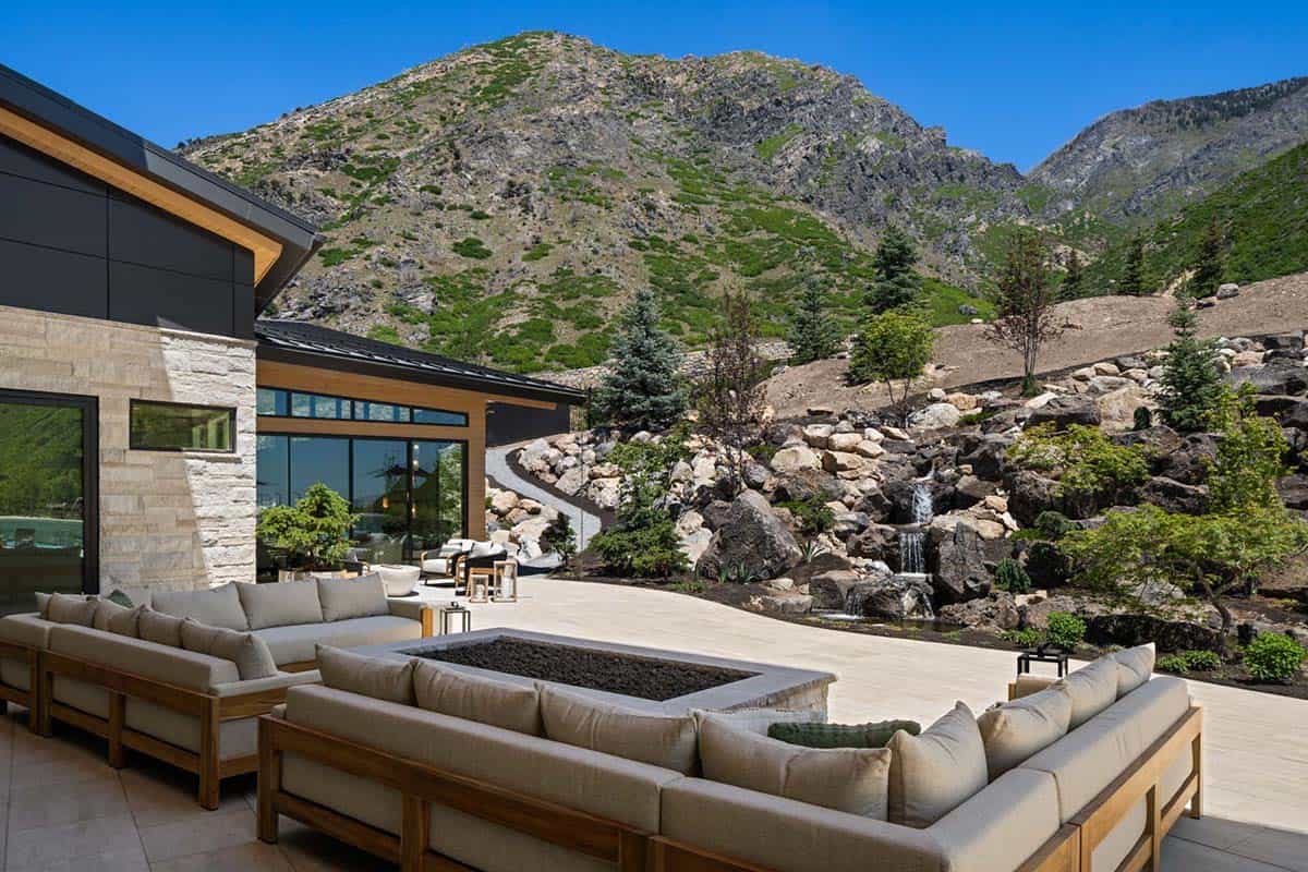 luxury modern home exterior with a patio and outdoor furniture