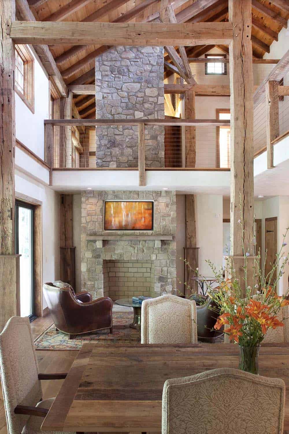 modern barn style living room with a fireplace