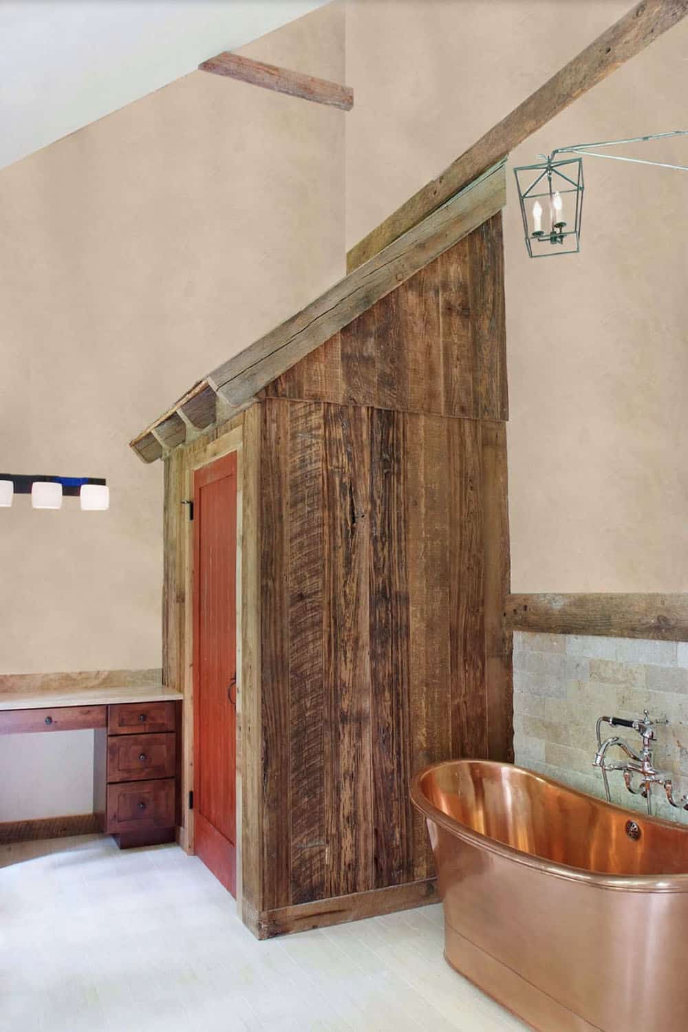 modern barn style bathroom with a copper tub
