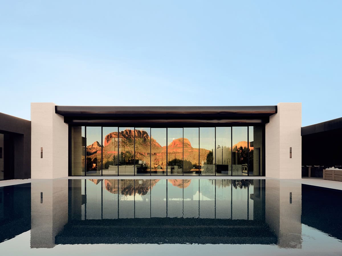 modern mountain home exterior with a pool